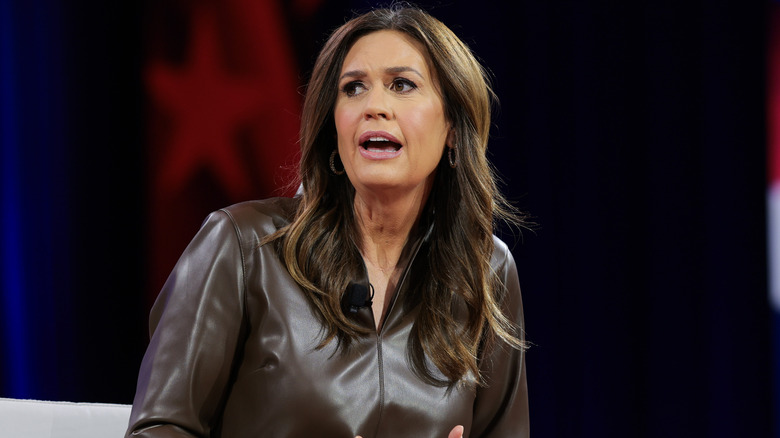 Sarah Huckabee Sanders talking on stage in full glam