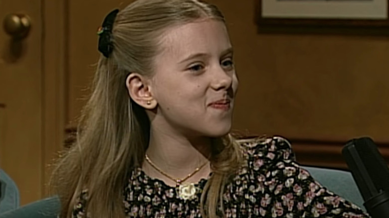 Scarlett Johansson smiles as a child on camera
