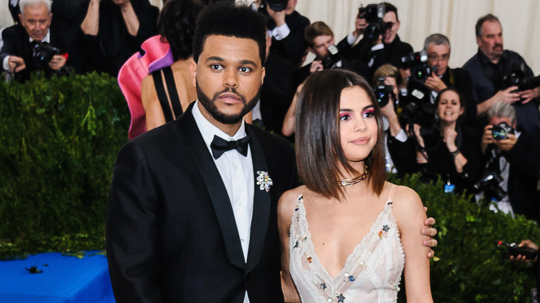 Selena Gomez, The Weeknd, posing