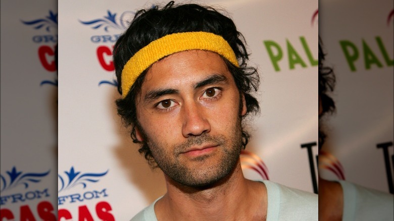 Taika Waititi wearing yellow headband