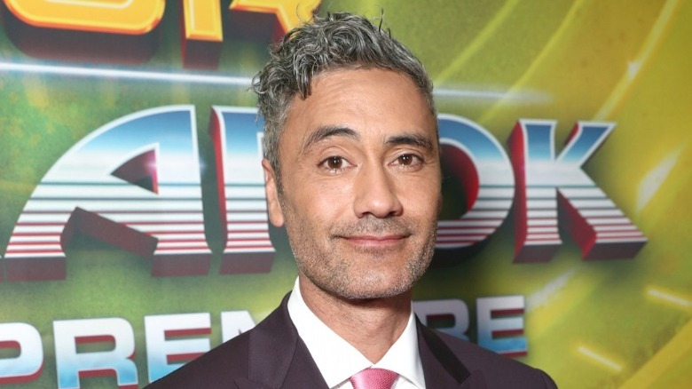 Taika Waititi smiling at camera
