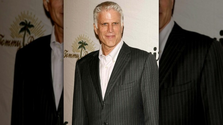 Ted Danson smizing on red carpet in suit