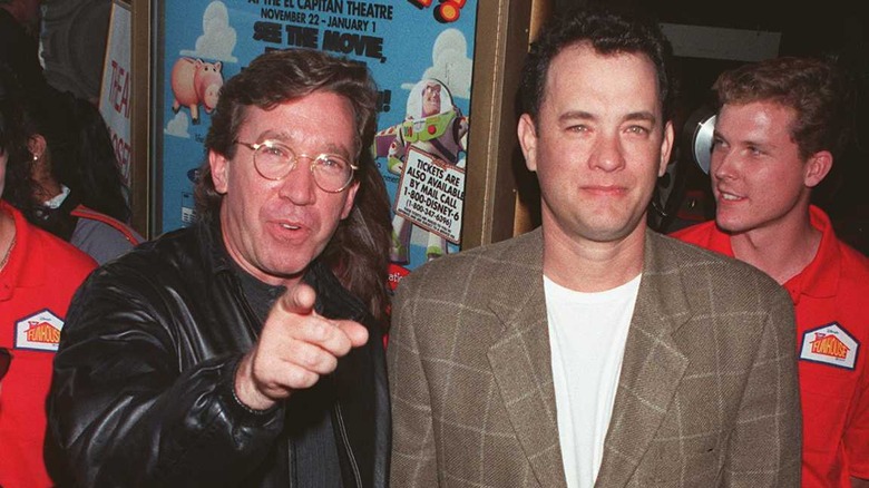 Tim Allen and Tom Hanks posing for a media call for "Toy Story" in 1995