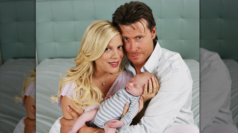Tori and Dean holding newborn son