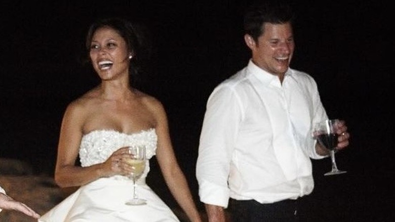 Vanessa Lachey laughing with Nick Lachey and walking