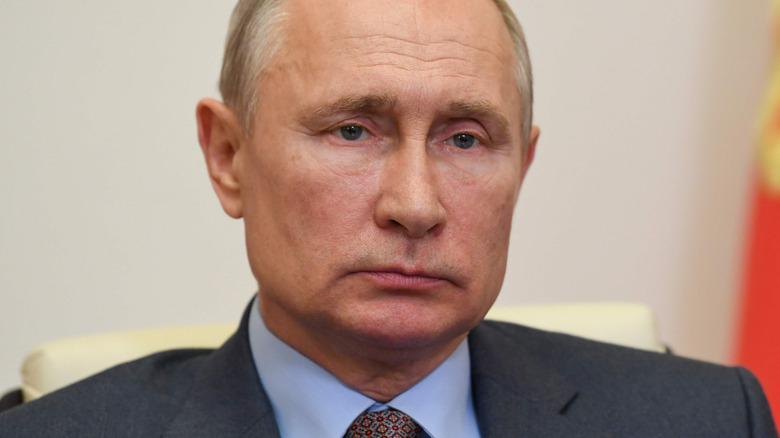 Vladimir Putin wearing a dark gray suit