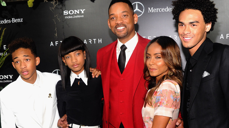 Will Smith smiling with his family