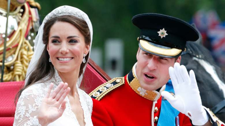 Kate Middleton and Prince William waving on their wedding day