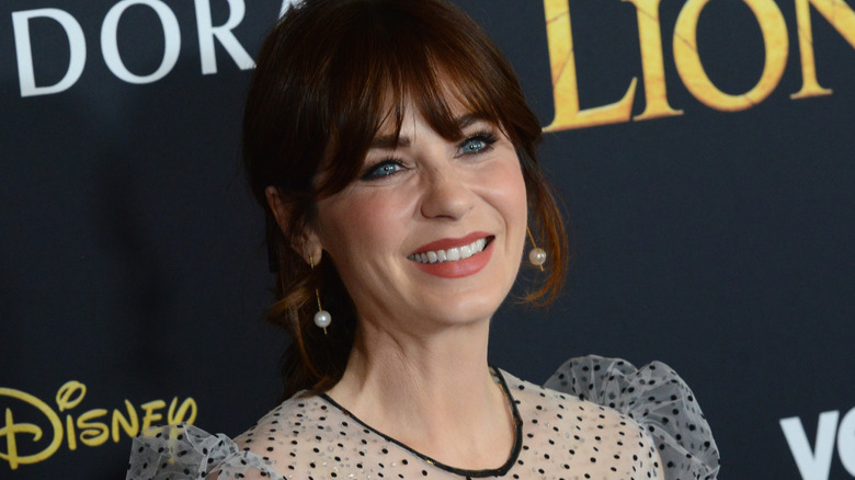 Zooey Deschanel arrives for the Premiere Of Disney's "The Lion King"