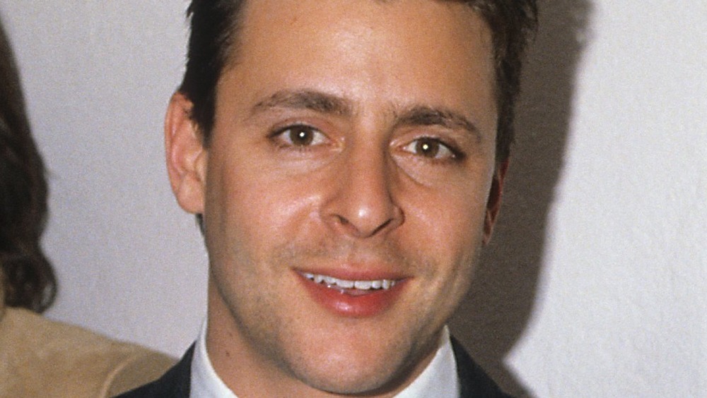 young Judd Nelson smiling 