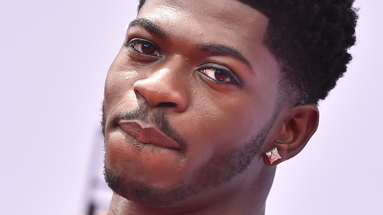 Lil Nas X slightly smiling