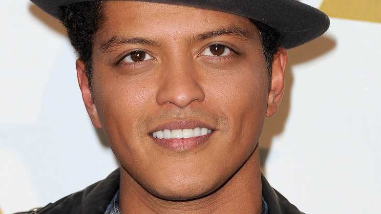 Bruno Mars with a serious expression