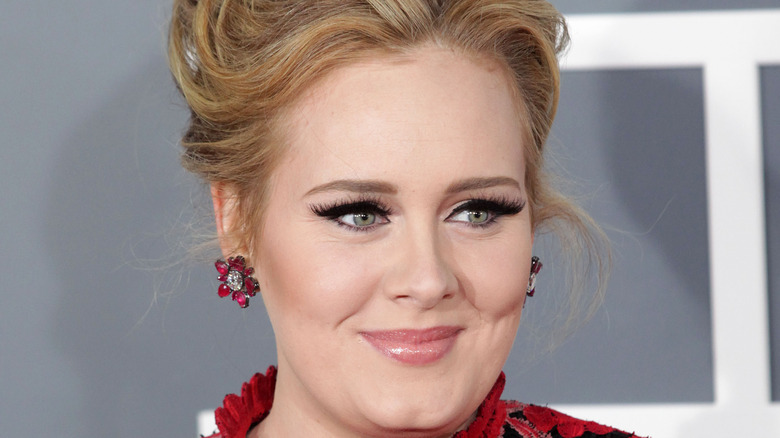 Adele wearing pink flower earrings