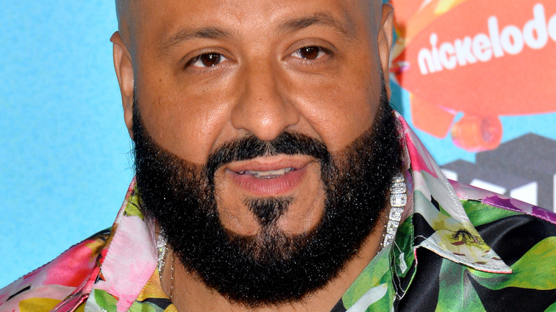 DJ Khaled posing in Hawaiian shirt