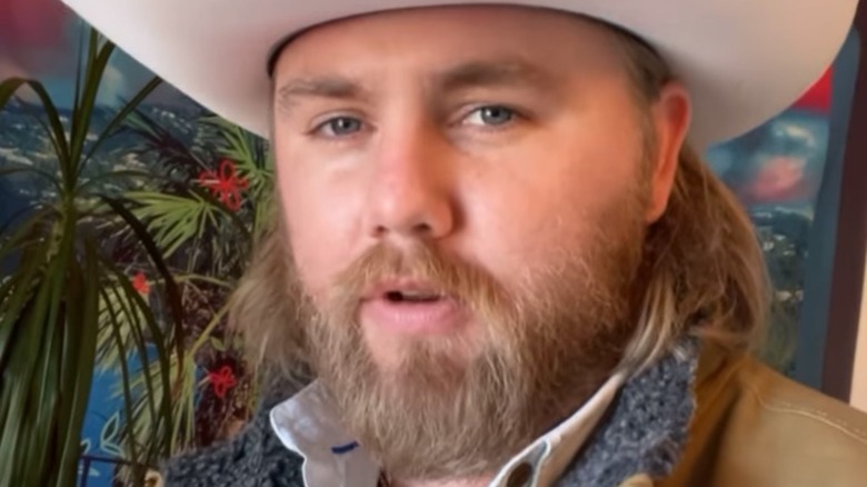 Country singer Ernest cowboy hat talking