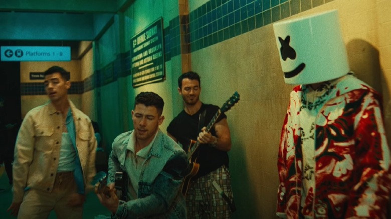Jonas Brothers and Marshmello performing