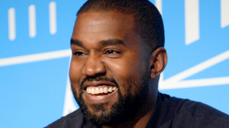 Kanye West smiling laughing
