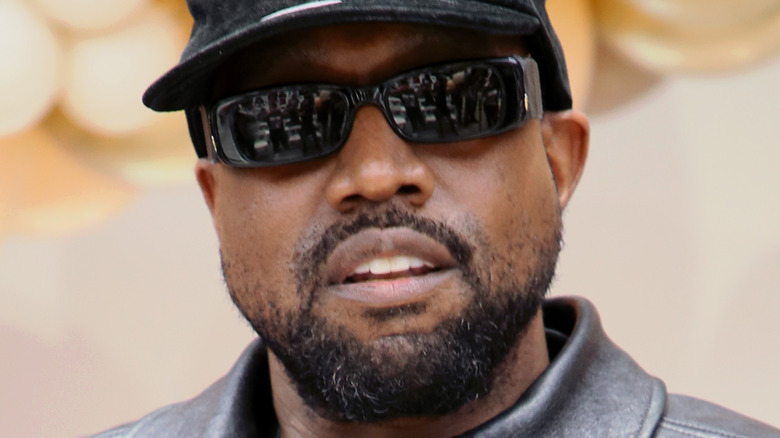 Kanye West wearing sunglasses at a 2021 Thanksgiving event