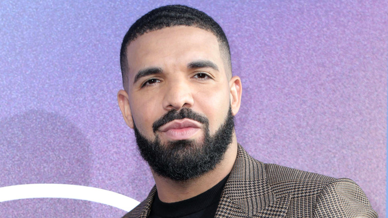 Drake with a serious expression