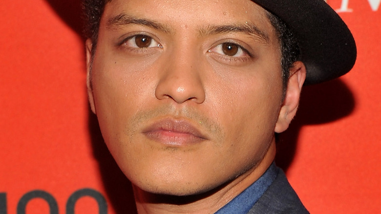 Bruno Mars with a serious expression