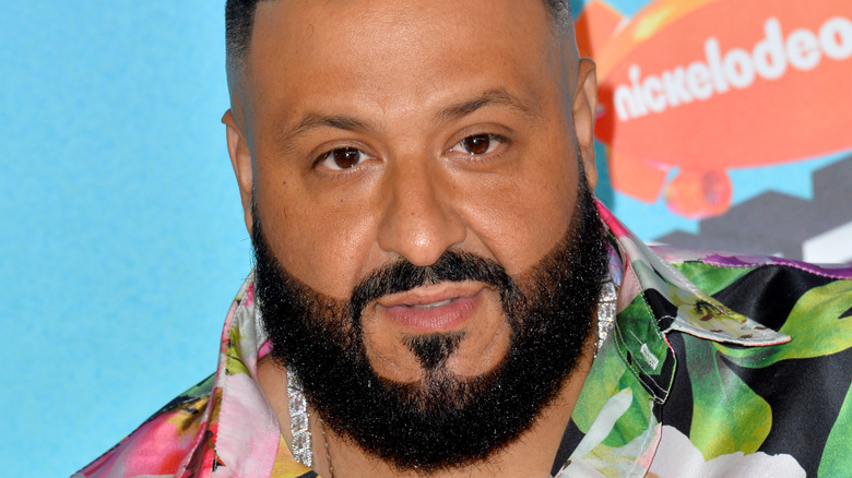 DJ Khaled, 2019 Nickelodeon red carpet, colorful flow shirt, facial hair, not smiling 