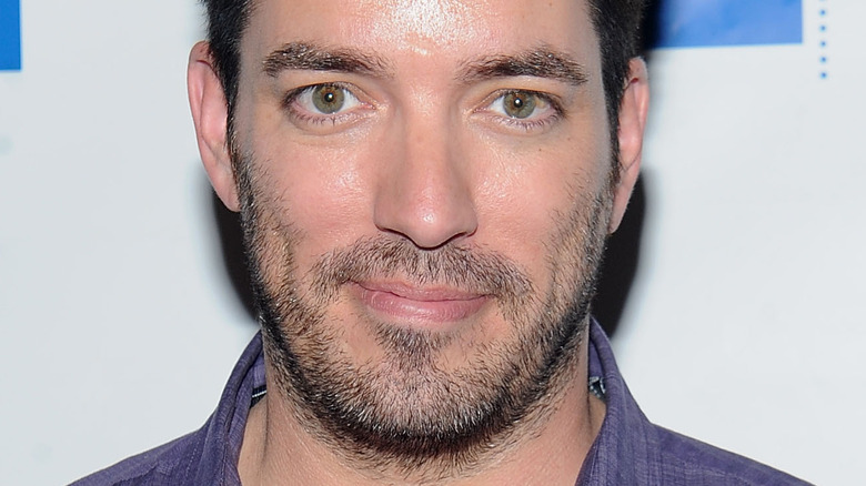 Jonathan Scott with scruff smiling