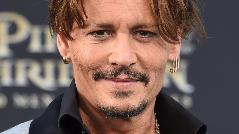 Johnny Depp arrives for a movie premiere