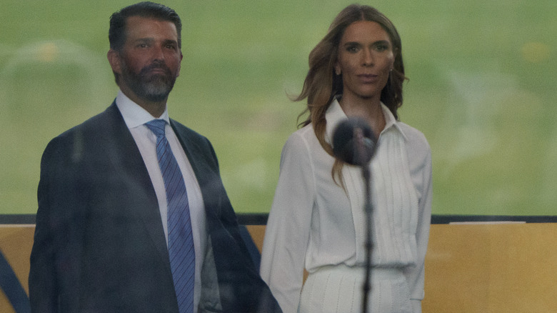 Donald Trump Jr. and Bettina Anderson arrive at Donald Trump's military parade.