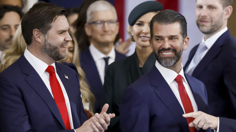 JD Vance and Donald Trump Jr. in matching suits and ties.