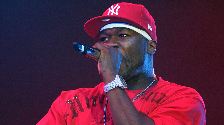 50 Cent rapping into a microphone 