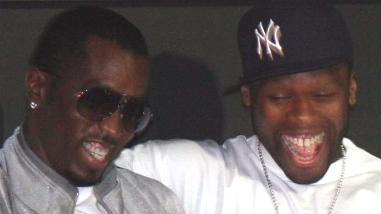 Diddy and 50 Cent smiling