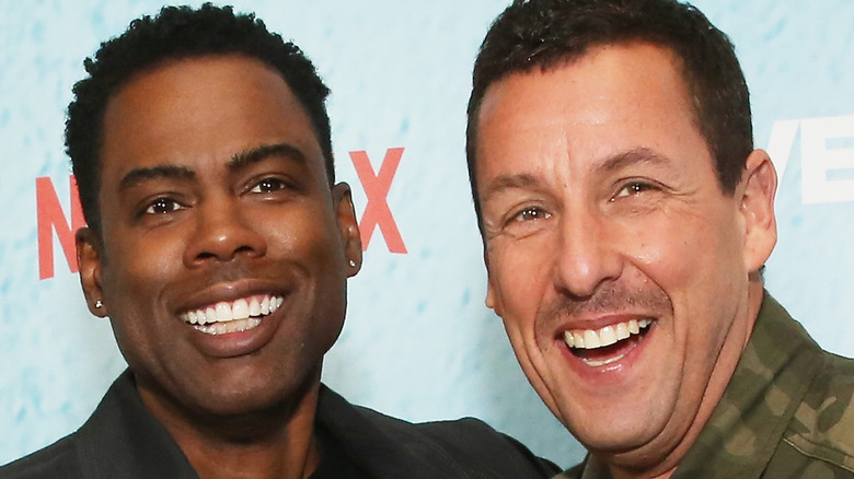 Chris Rock and Adam Sandler smile