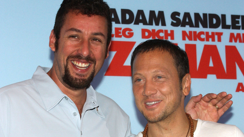 Adam Sandler and Rob Schneider smiling