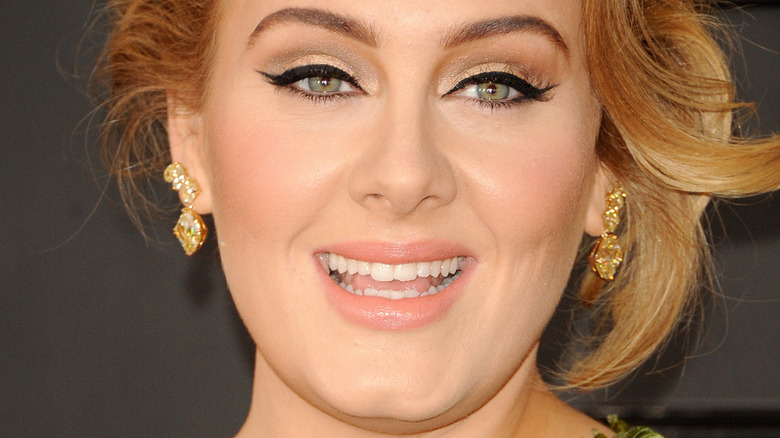 Adele smiling with an updo