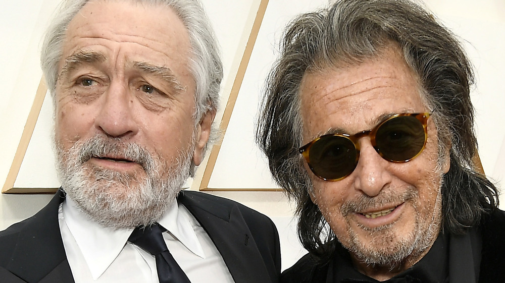 Robert de Niro and Al Pacino smile together on the red carpet