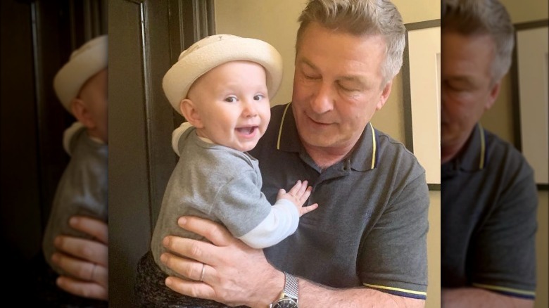 Alec Baldwin holding Romeo Baldwin