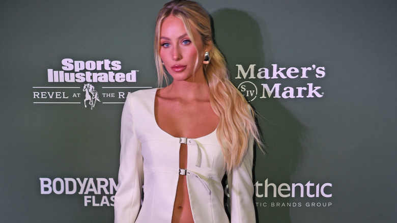 Alix Earle on red carpet in white outfit