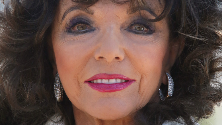 Joan Collins smiles