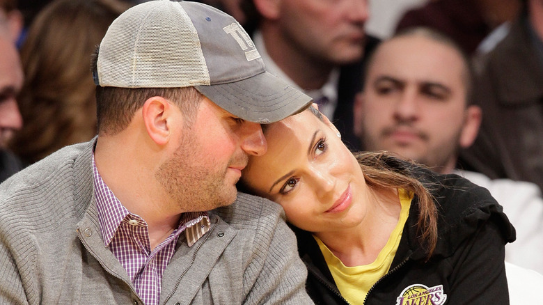 Alyssa Milano and her husband David Bugliari at a basketball game