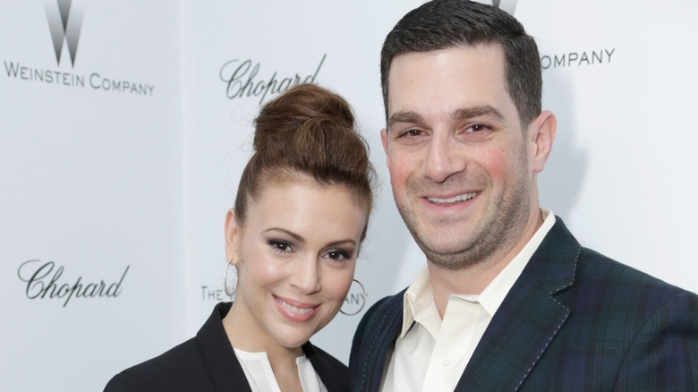 Alyssa Milano and her husband Dave Bugliari smiling