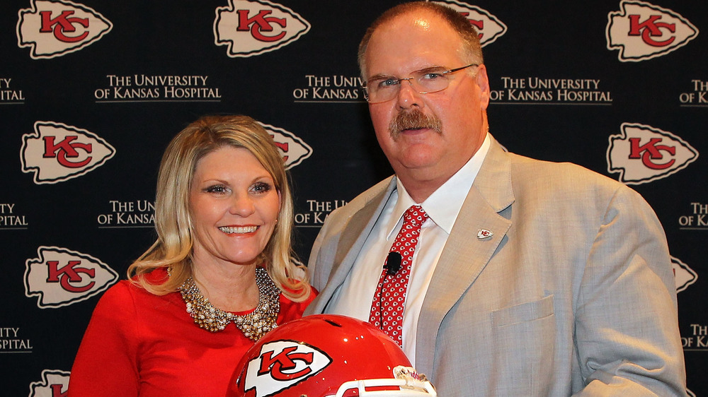 Andy Reid poses with his wife Tammy during a press conference in 2013