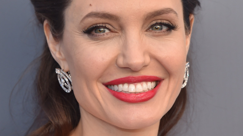 angelina jolie red lip diamond earrings