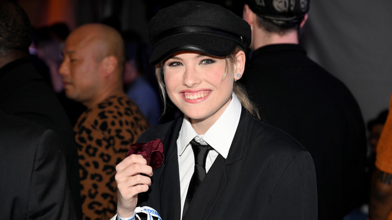 Dannielynn Birkhead wearing a jacket, tie, and cap