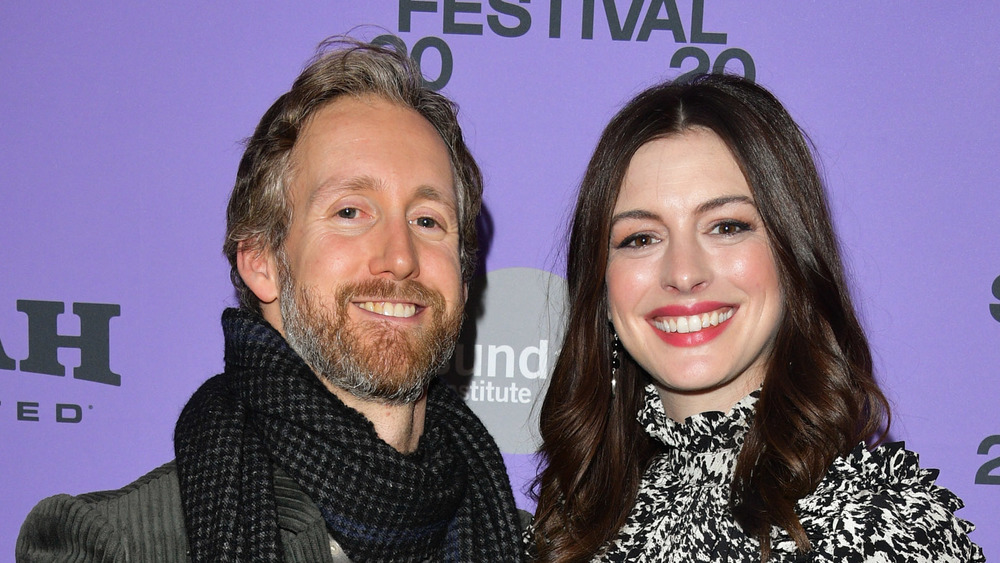 Adam Shulman and Anne Hathaway attend an event