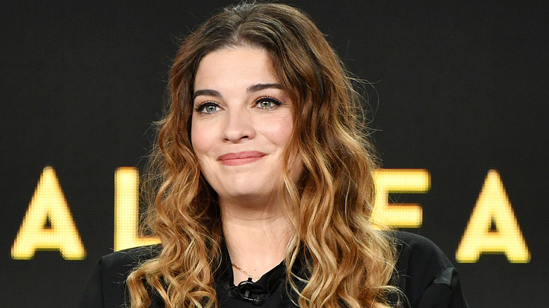 Annie Murphy onstage at an event