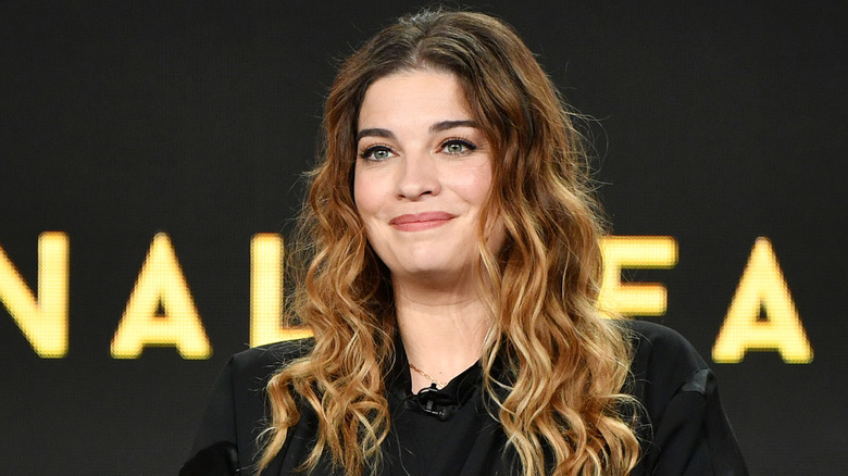 Annie Murphy onstage at an event