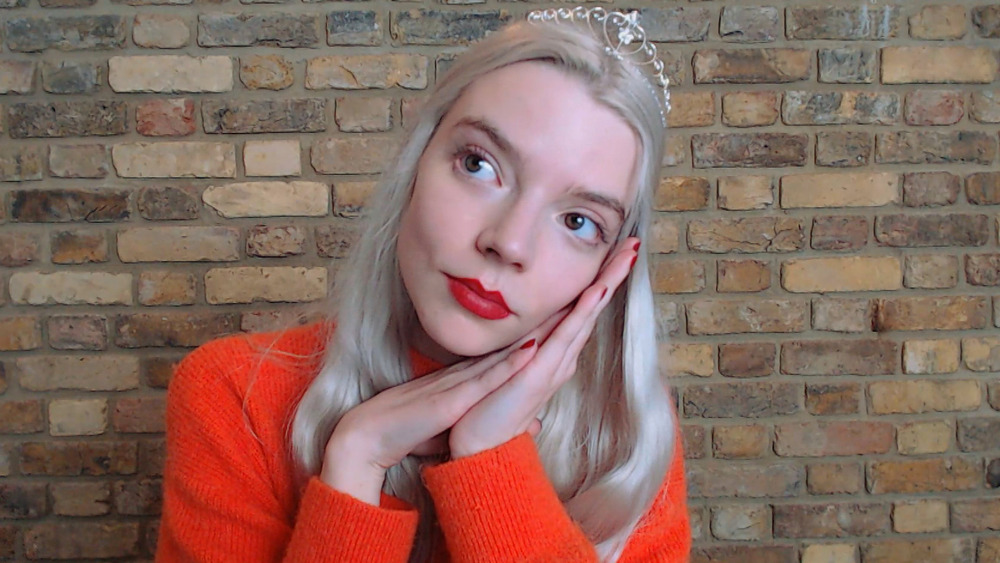 Anya Taylor-Joy wearing tiara and red top