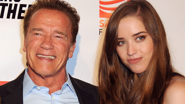Arnold and Christina Schwarzenegger posing