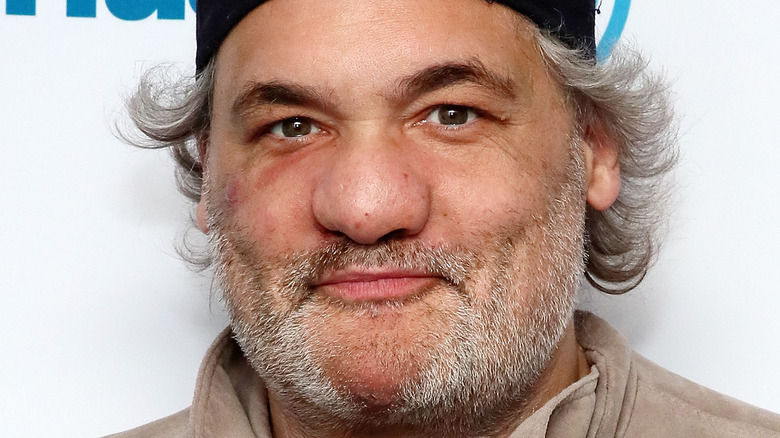 Artie Lange, wearing a hat, beard