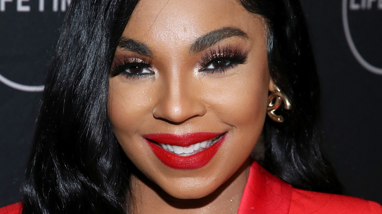 Ashanti smiling on the red carpet